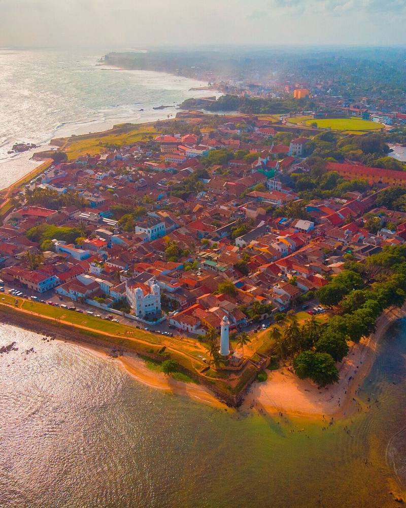 Aerial view of the ramparts and red-roofed old town of Galle Fort on its headland, Galle, Sri Lanka