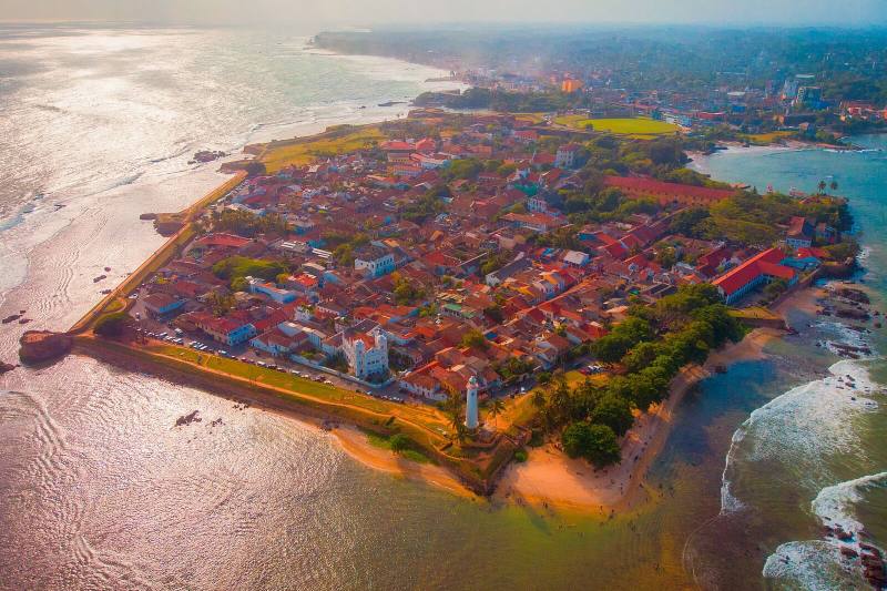 Aerial view of the ramparts and red-roofed old town of Galle Fort on its headland, Galle, Sri Lanka