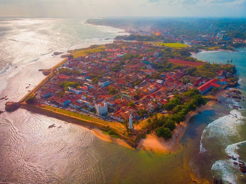 Aerial view of the ramparts and red-roofed old town of Galle Fort on its headland, Galle, Sri Lanka