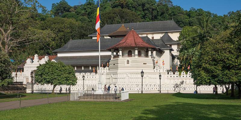 White walls and red-roofed octagon of the Temple of the Sacred Tooth Relic, Kandy, Sri Lanka