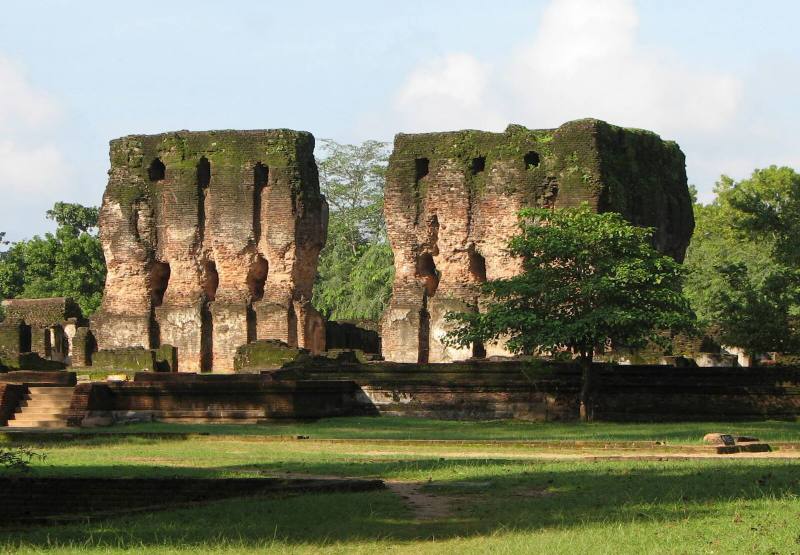 Brick walls of the Royal Palace ruins above green lawns, Polonnaruwa, Sri Lanka