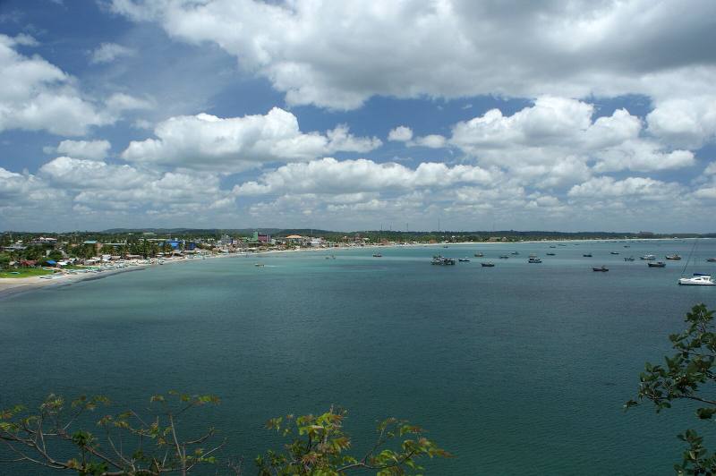 Sweeping turquoise bay dotted with boats, with the town along the shore, Trincomalee, Sri Lanka